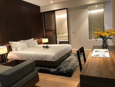 The bedroom area is fitted with high quality wooden flooring
