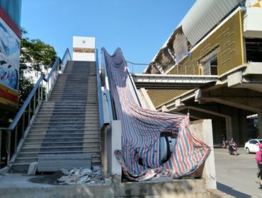 The electric escalator section is covered only with a protective canvas